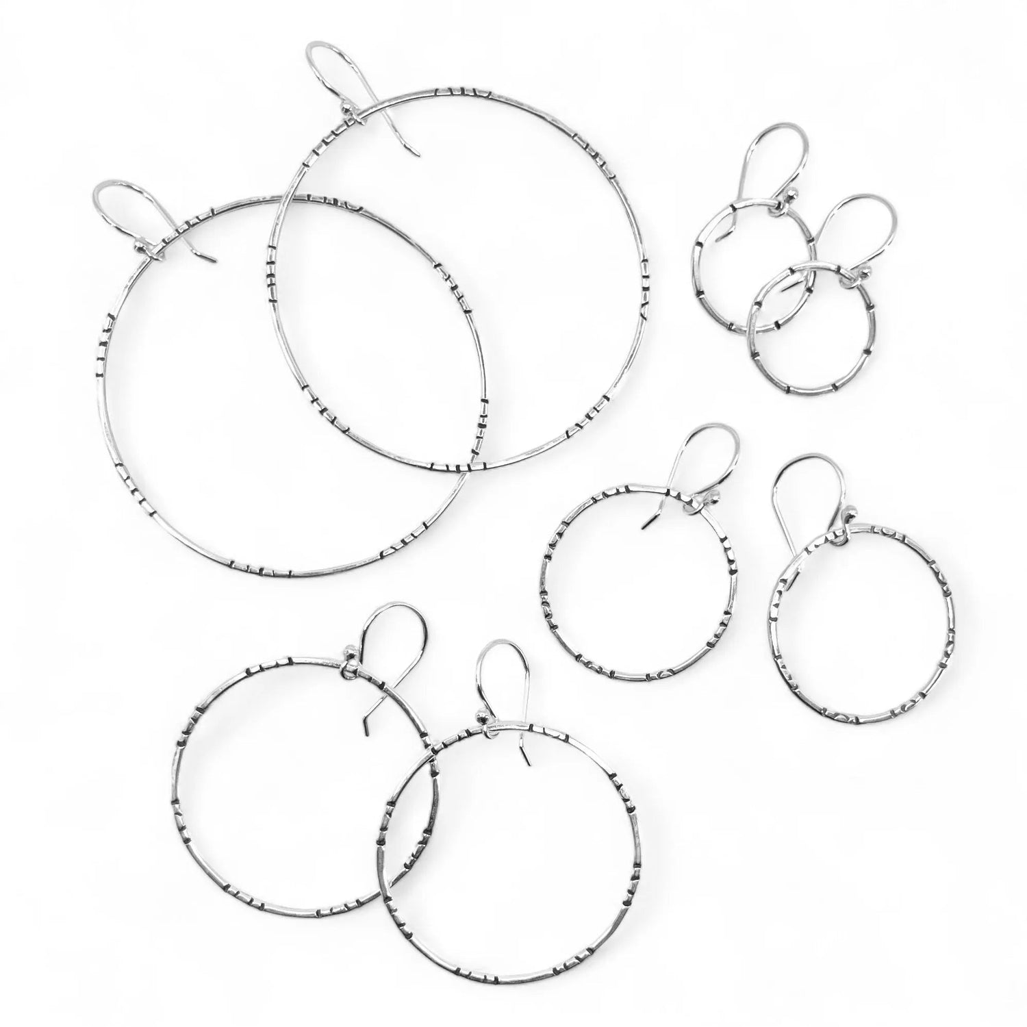 assorted sized sterling silver stamped hoop earrings