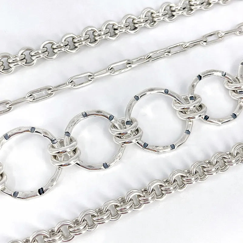 A variety of sterling silver chain bracelets by Kristin Christopher