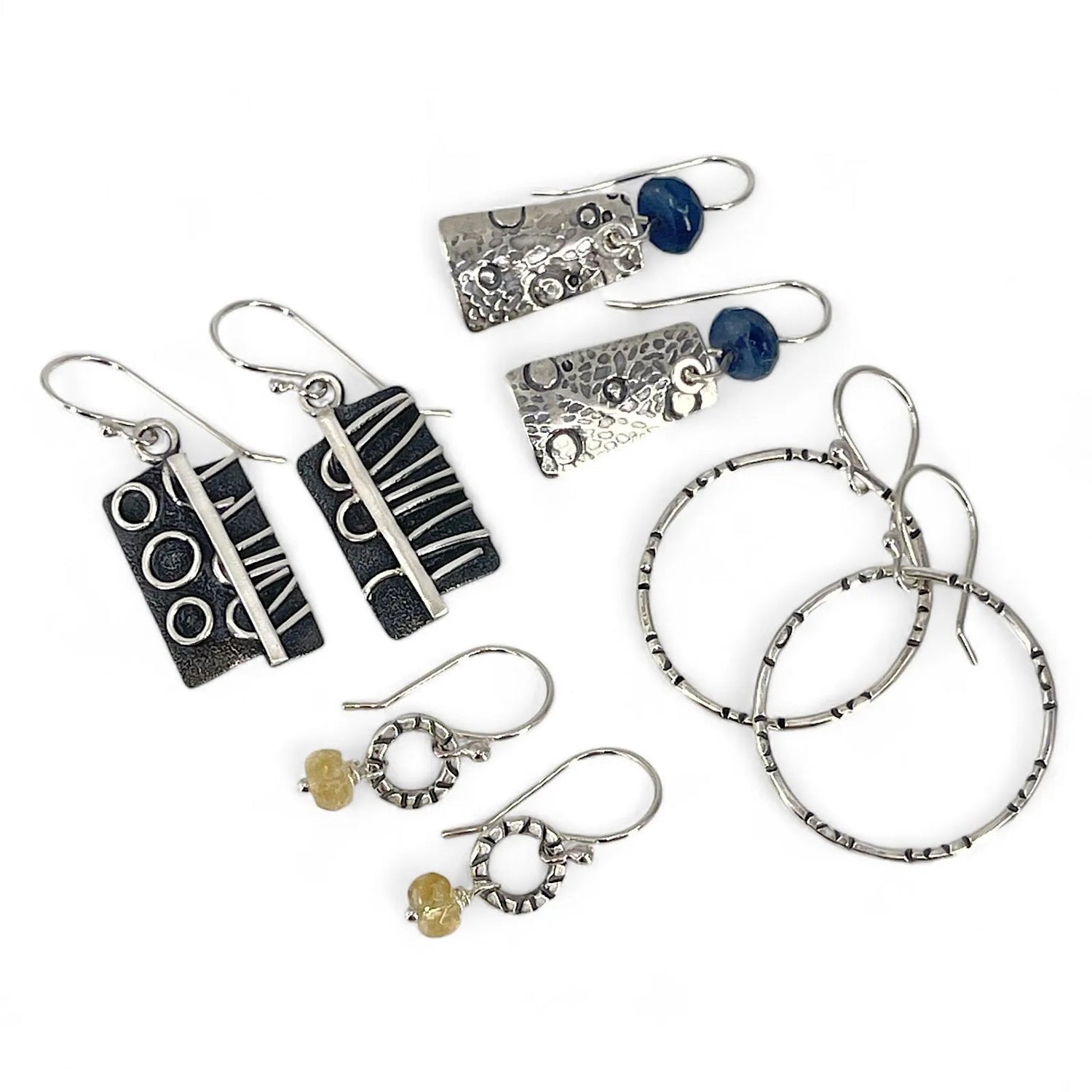 Assorted sterling silver earrings, hoops, dangles, fabricated, stamped and patina