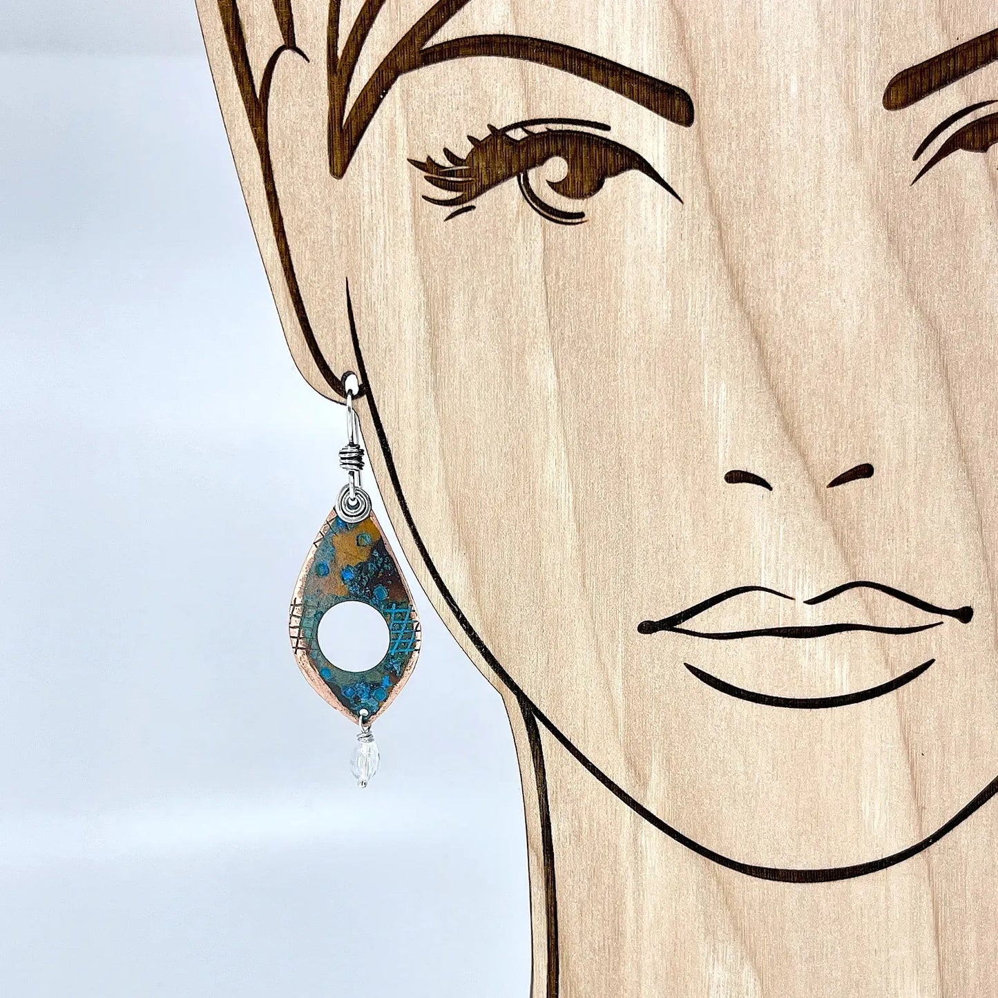 Dangle Copper Blue Patina Earrings with Clear Quartz on model